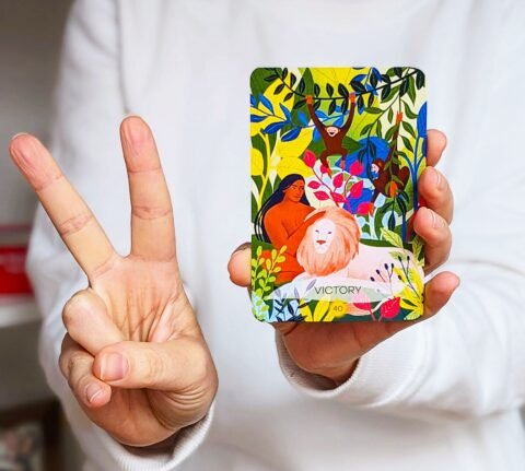 Paradise Oracle Deck in a woman's hand